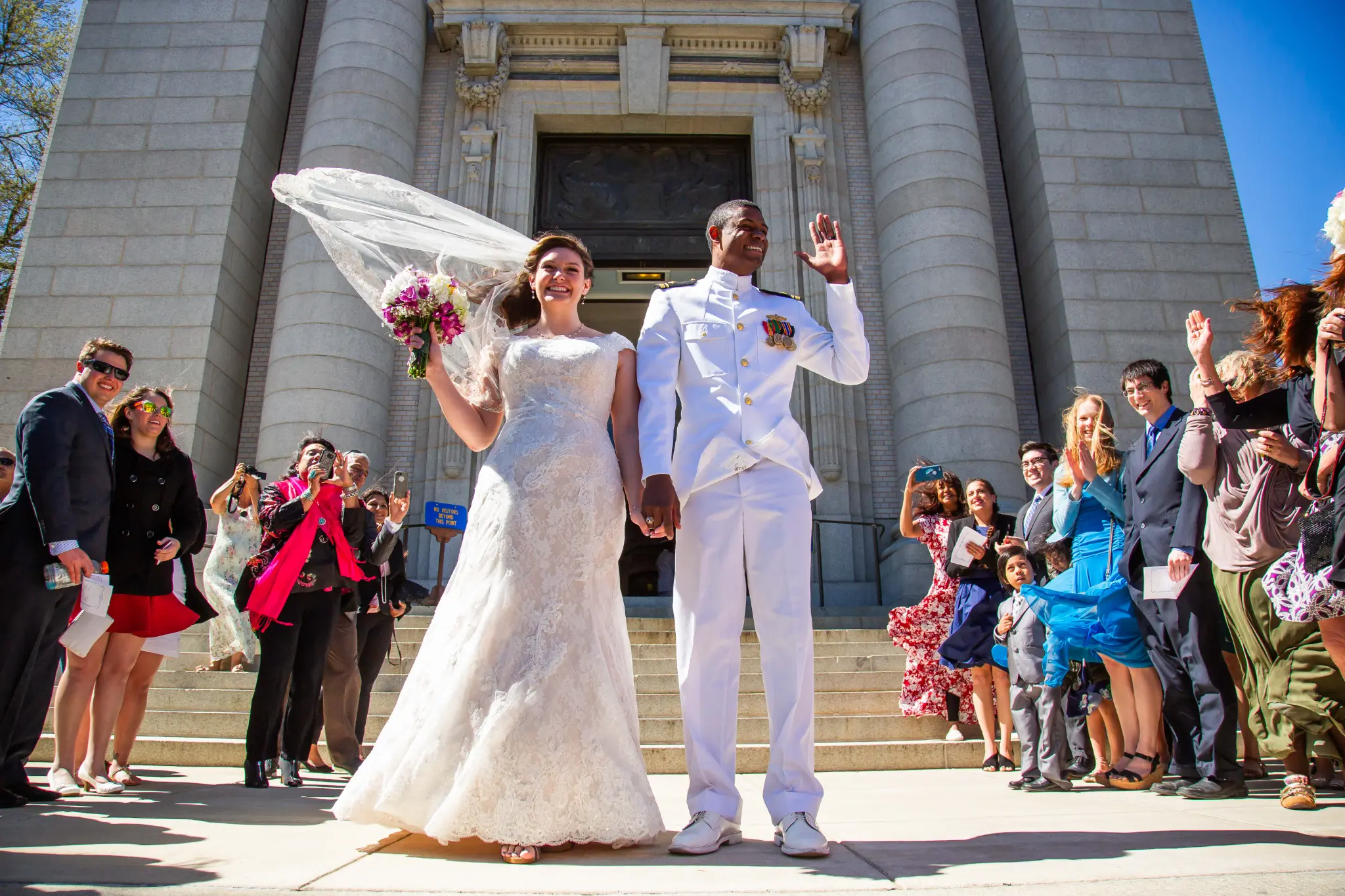Couple walking through the Naval Academy Chapel aisle — Andrew Rozario documentary wedding photography