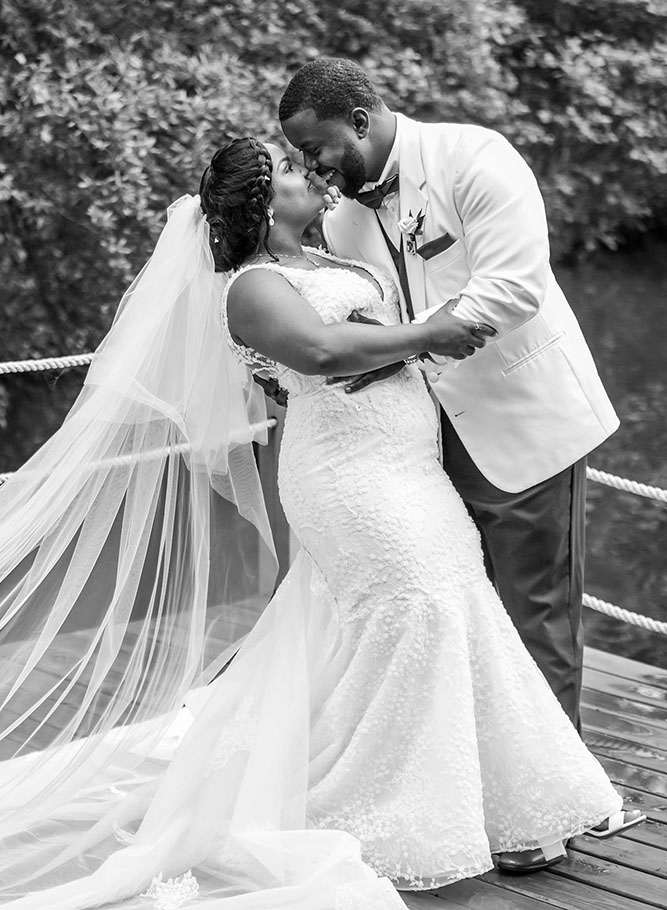 Couple in black and white dock portrait