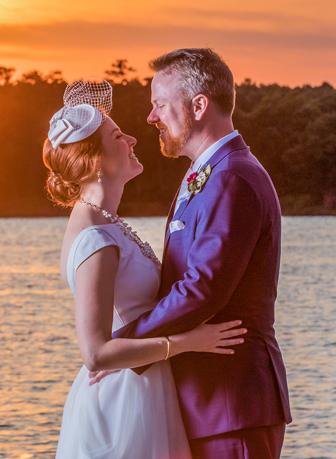 Couple sharing a joyful moment at waterfront sunset — Andrew Rozario outdoor wedding photographer