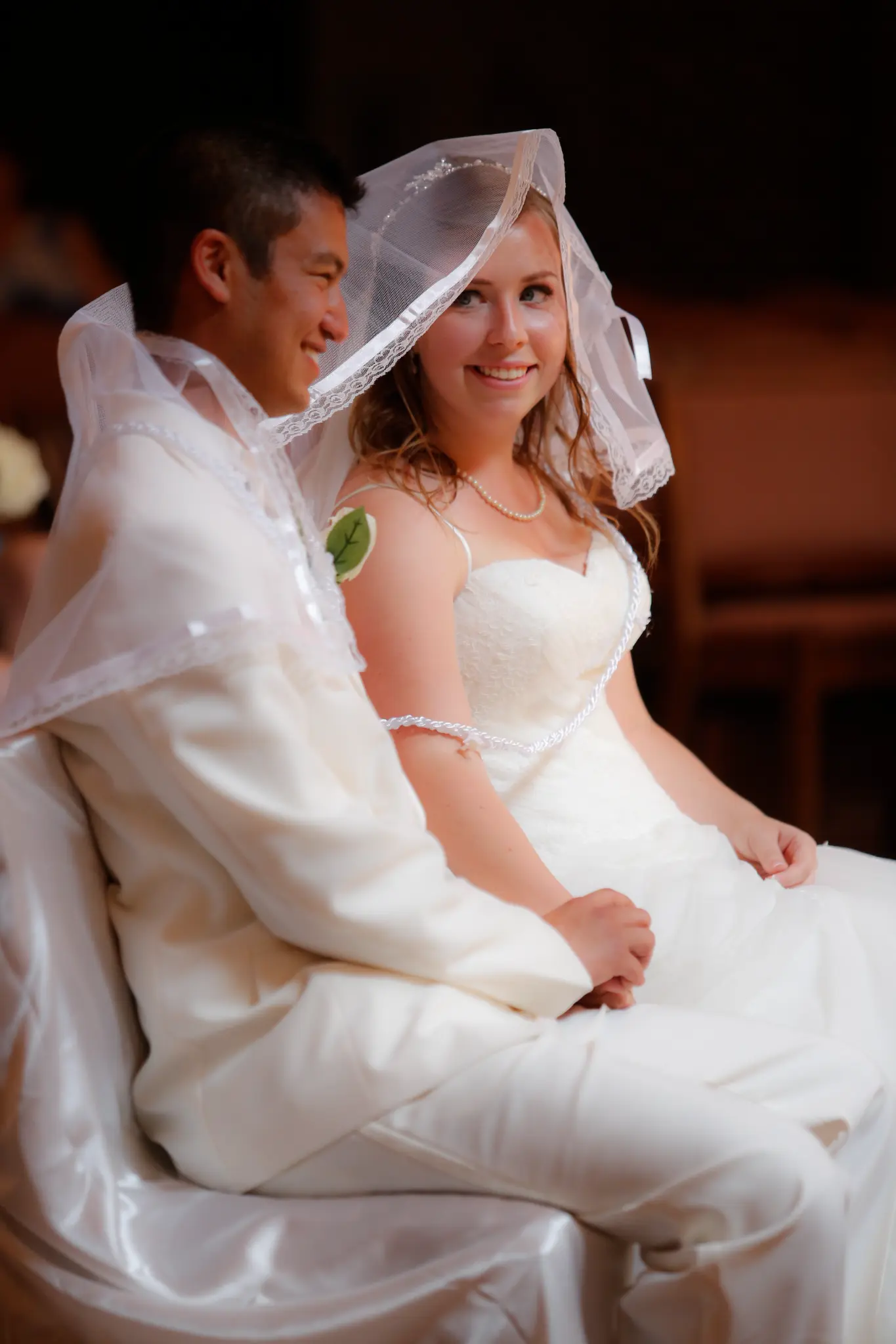 Bride and groom sharing a quiet moment during the ceremony